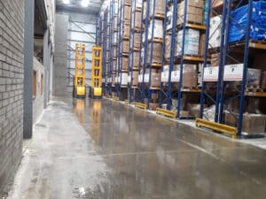 Tall forklift in warehouse - high pallet racking VNA guidance systems Dublin Ireland